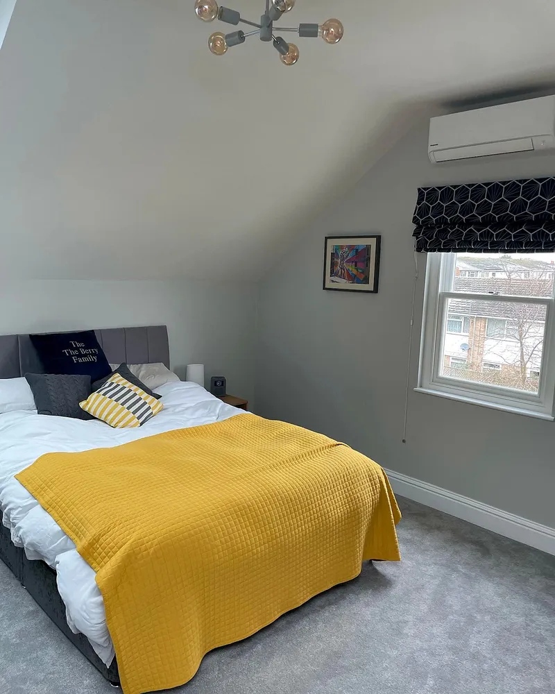 Loft conversion with bedroom, ensuite bathroom, and walk-in wardrobe in Richmond, London by Bluebird Spaces