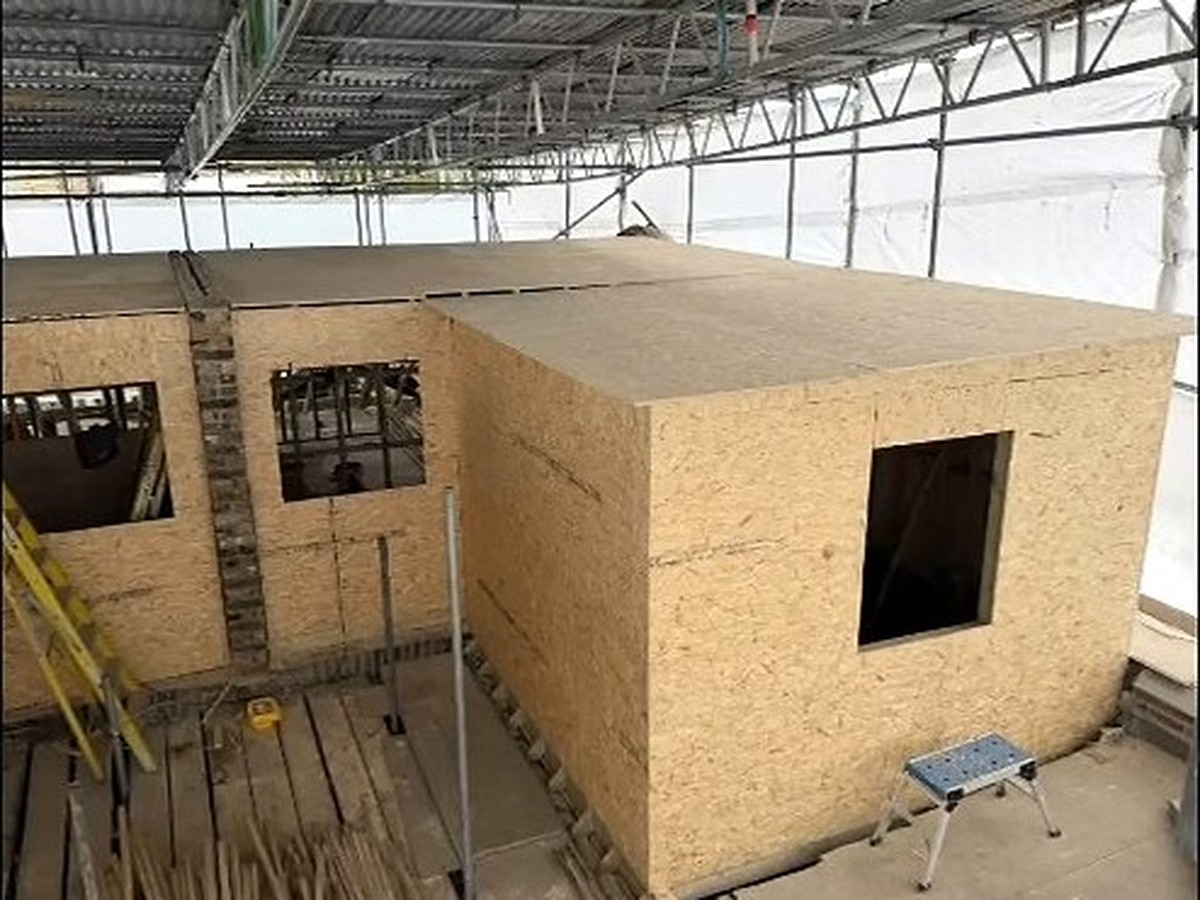 Loft structures under construction across two neighbouring terraced houses in Fulham, West London