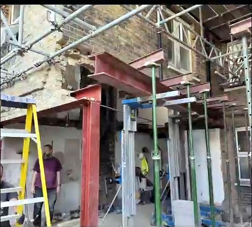 Structural steelwork and temporary supports during the rear and side extension phase in Fulham