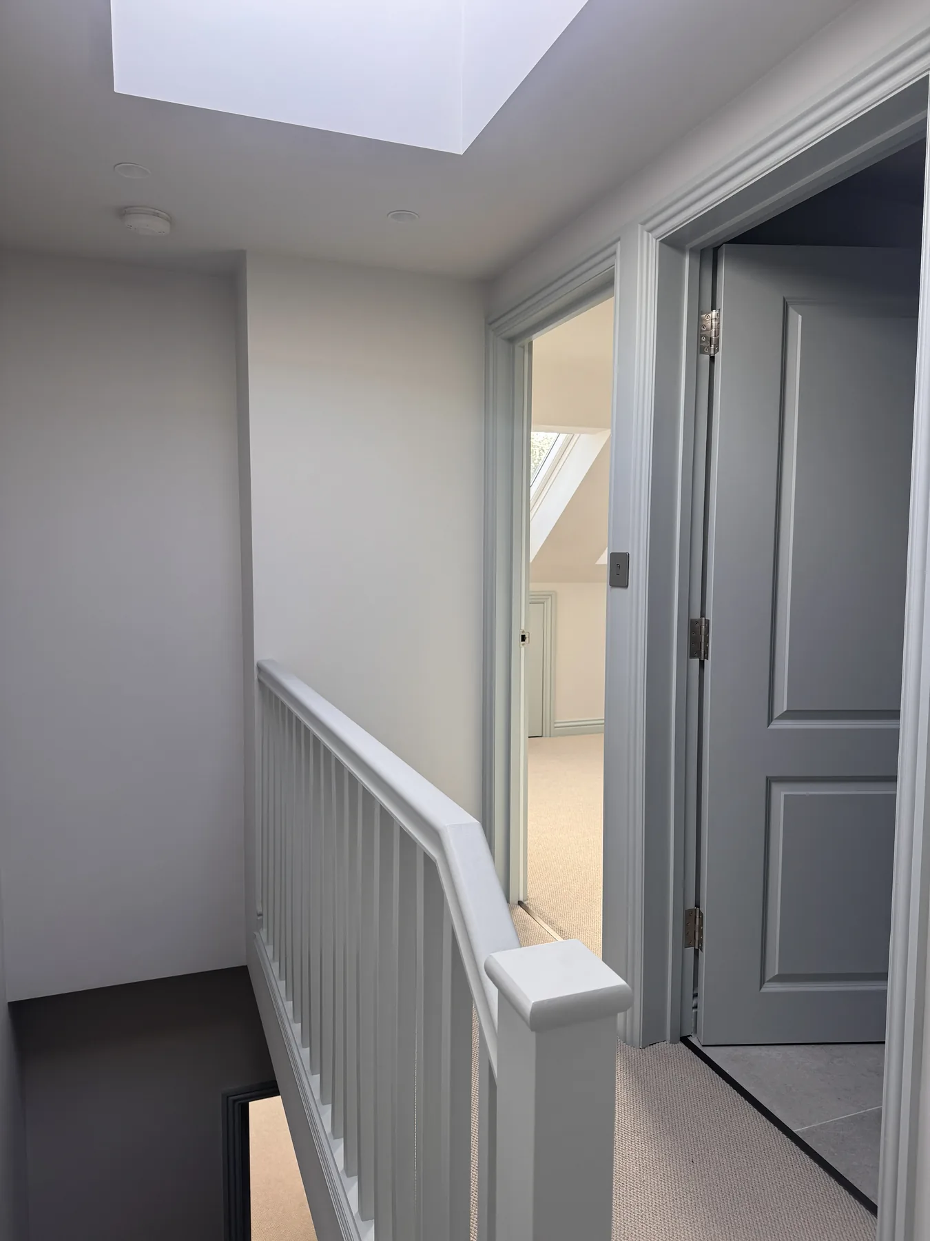 Bright loft landing with new balustrade, doors and rooflight