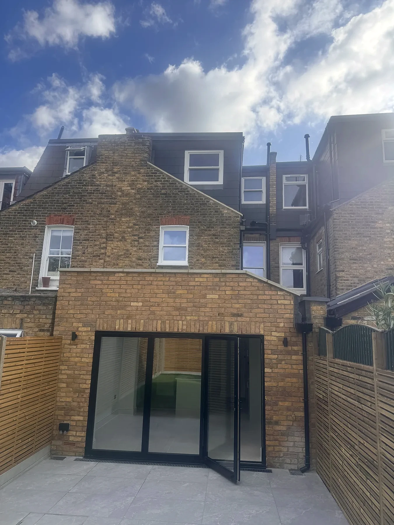 Completed open-plan kitchen and rear extension in Wimbledon by Bluebird Spaces — view 2